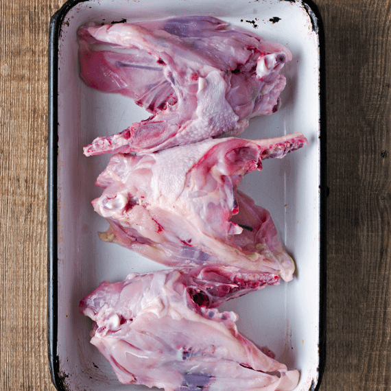 feeding dog raw chicken carcass